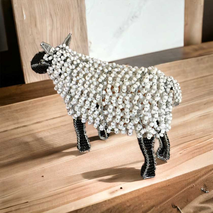 Close-up view of the Handmade African Bead & Wire Sheep sculpture, showcasing its intricate beadwork, wire craftsmanship, and lifelike sheep design