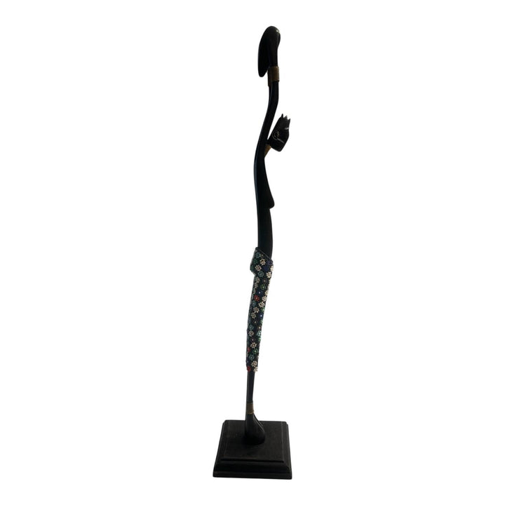 Black abstract sculpture on a white background