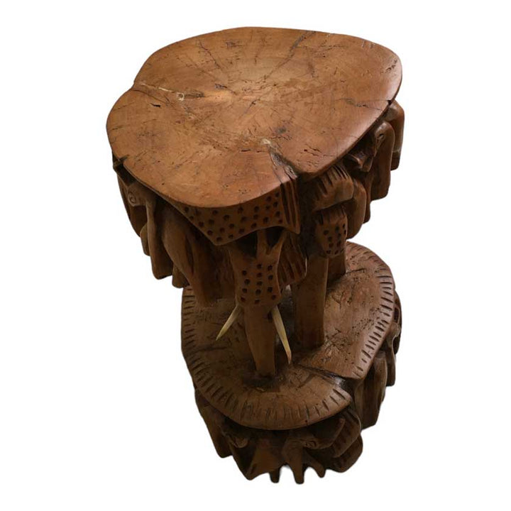 Close-up view of the Antique African Hand Carved Wooden Elephant Stool, showcasing the intricate woodwork and lifelike elephant design.