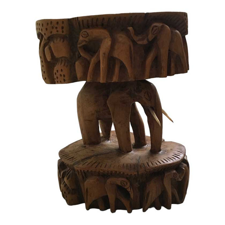 Close-up view of the Antique African Hand Carved Wooden Elephant Stool, showcasing the intricate woodwork and lifelike elephant design.