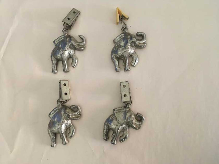 Antique elephant tablecloth holder clips