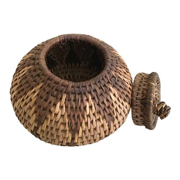 Beautifully handwoven African basket with a lid, showcasing intricate patterns and craftsmanship, a piece of African artistry for your home decor
