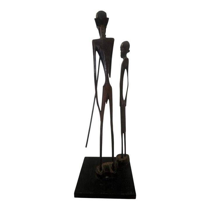 Decorative statue of two figures on a white background
