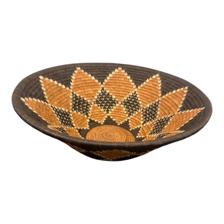 Woven bowl with a geometric pattern on a white background