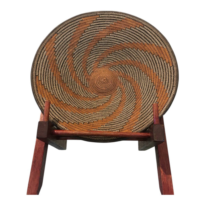 Woven chair with a wooden frame on a white background